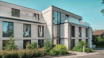 Photo extérieure de l'immeuble d'appartements Eleganza à Ostermundigen, équipé de fenêtres bois/aluminium EgoSelection